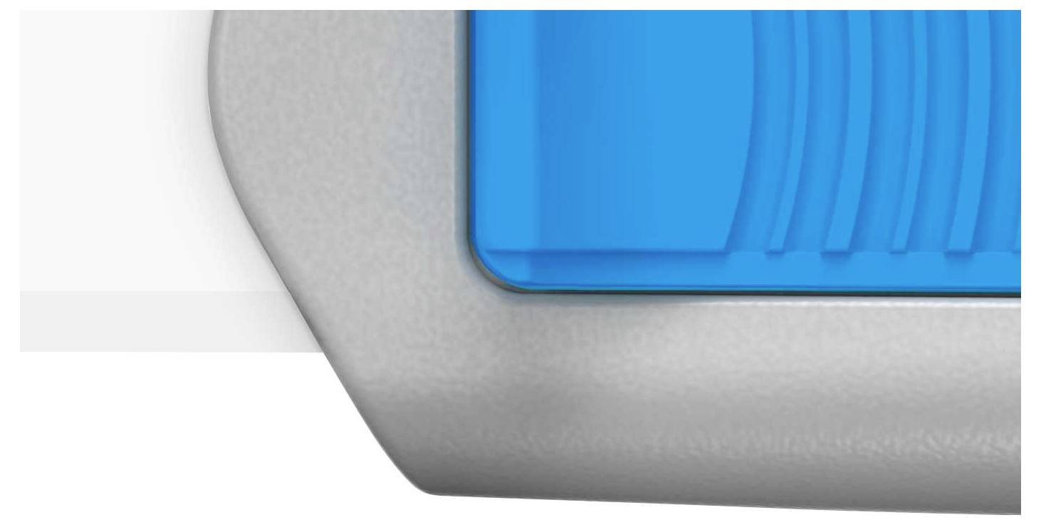 Une surface en plastique grise et bleue avec des lignes structurées, faisant partie d'un objet plus grand, probablement un appareil ou un outil.