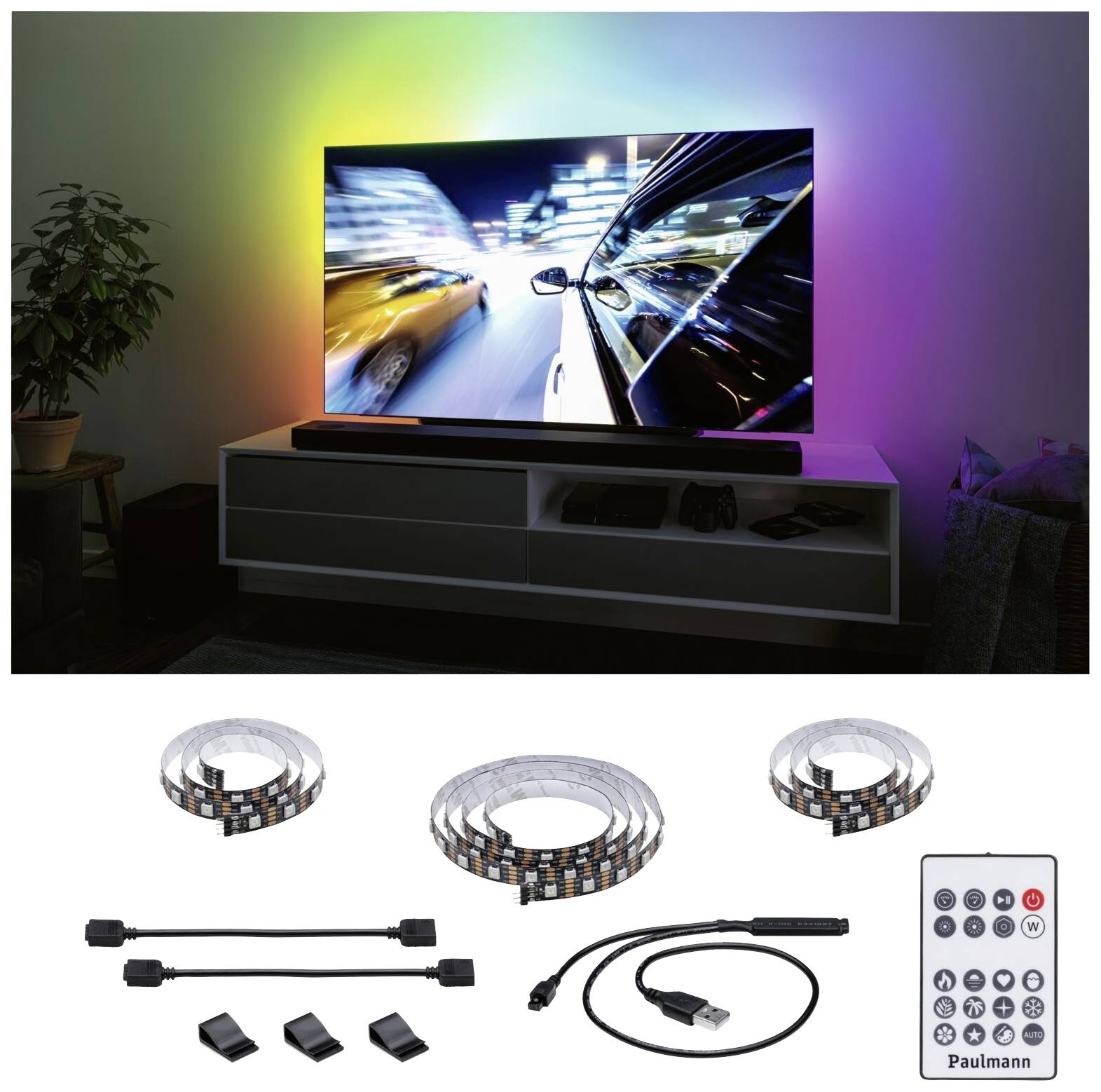 Téléviseur à écran plat avec un écran rétroéclairé multicolore sur un meuble TV moderne. En dessous, des bandes LED, une télécommande et des accessoires.