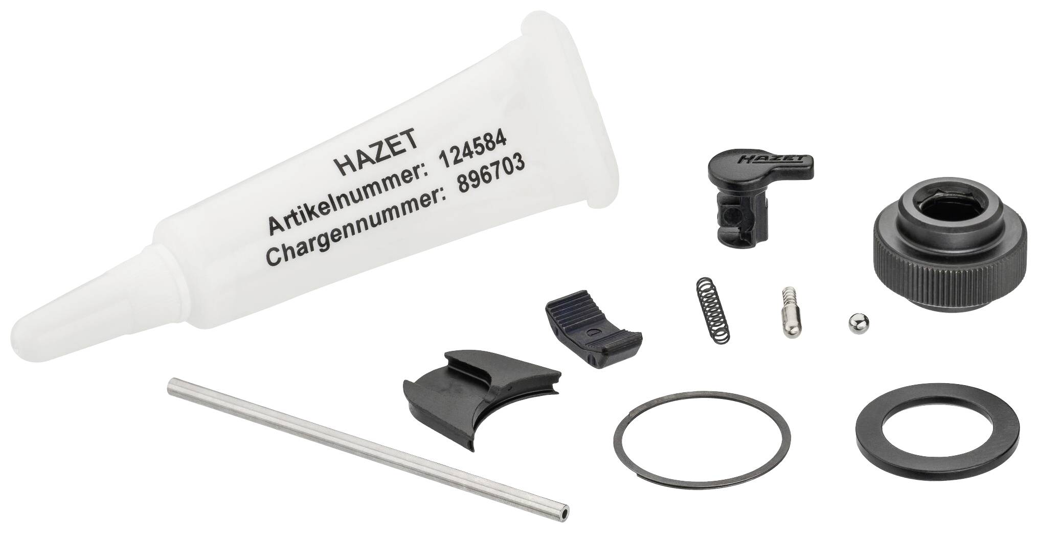 Petit kit de pièces avec lubrifiant, ressorts et joints pour réparation ou maintenance, étiquette : 'Numéro d'article et de lot HAZET'.