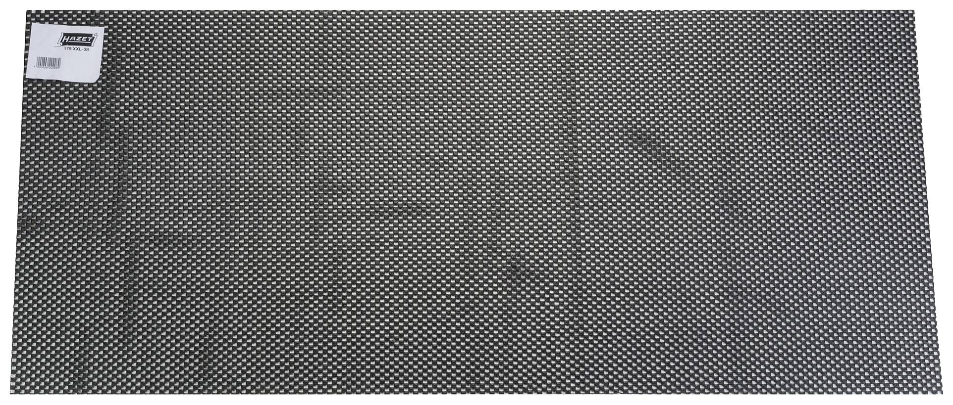 Tapis noir et blanc à pois avec une étiquette dans le coin supérieur gauche ; forme rectangulaire.