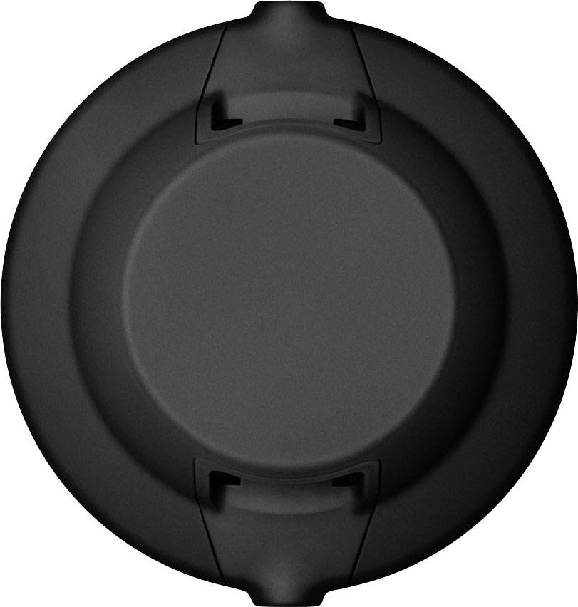 'Cercle noir aux bords ondulés, probablement un couvercle ou un capuchon, photographié d'un point de vue aérien.'