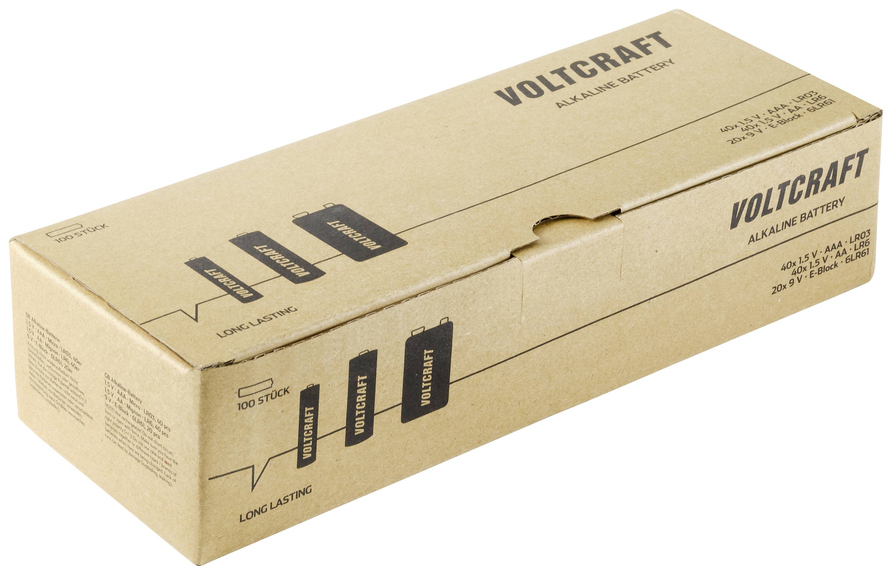 Une boîte en carton marron portant l'inscription 'Voltcraft' et 'Alkaline Battery'. Présente les détails du produit et des symboles indiquant une durée de vie prolongée.