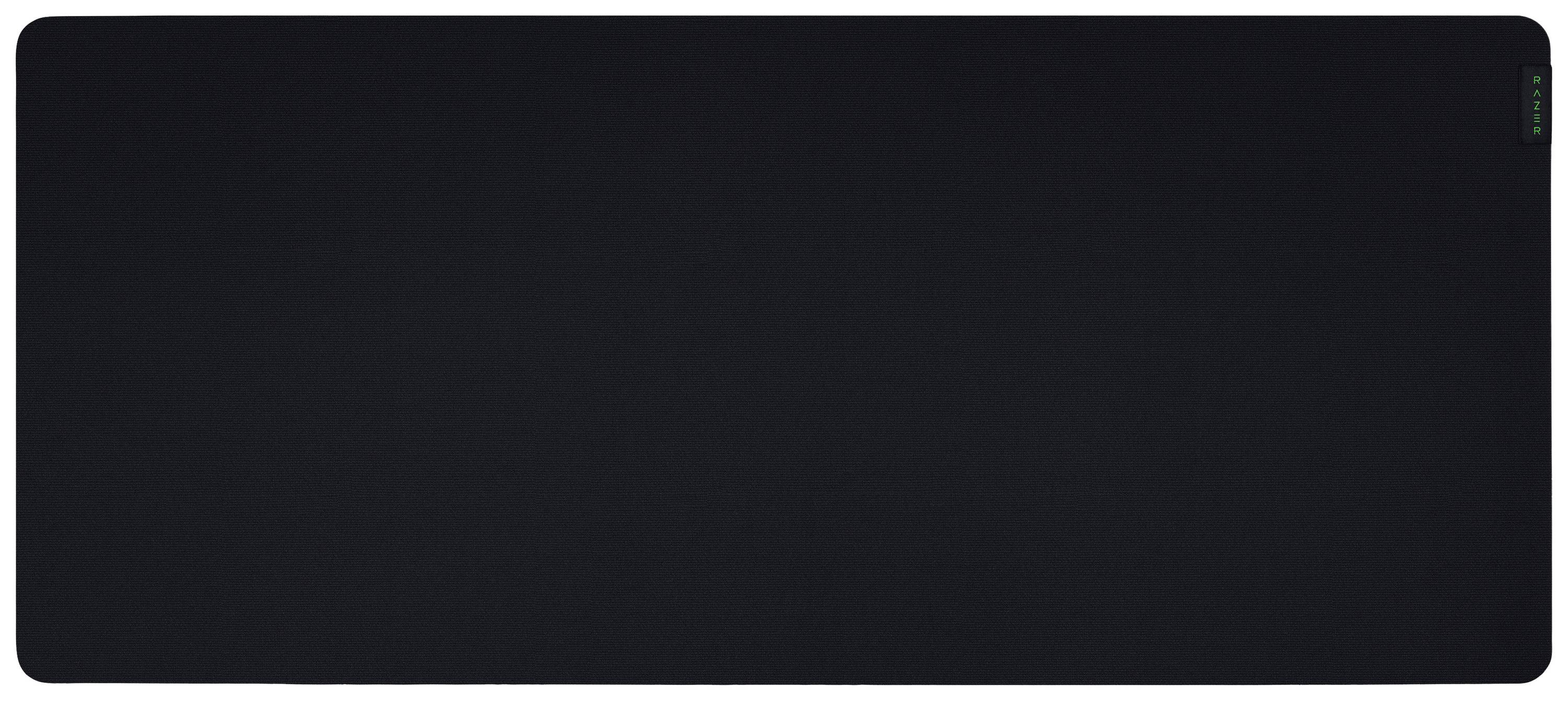 Surface noire rectangulaire, probablement un grand tapis de souris, sans motifs ou textures discernables.