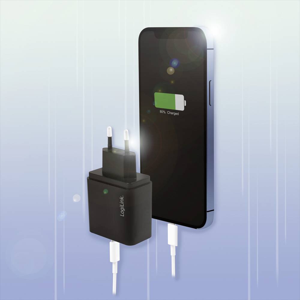 Un smartphone est en train de se charger et affiche un niveau de batterie de 80%. À côté se trouve un chargeur avec un câble branché.