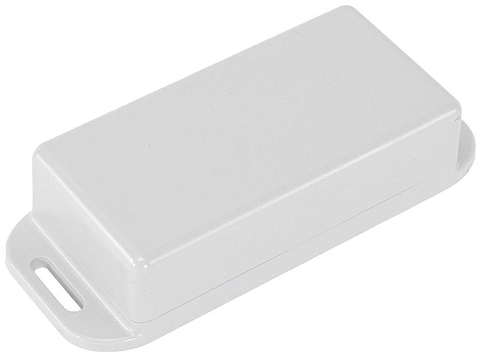 Un couvercle en plastique blanc, rectangulaire, aux coins arrondis et présentant une petite encoche sur un côté, est posé à plat sur une surface.