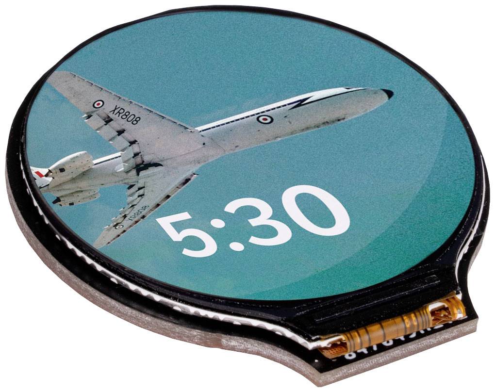 Horloge ronde avec une image d'avion sur le cadran, indiquant '5:30'.