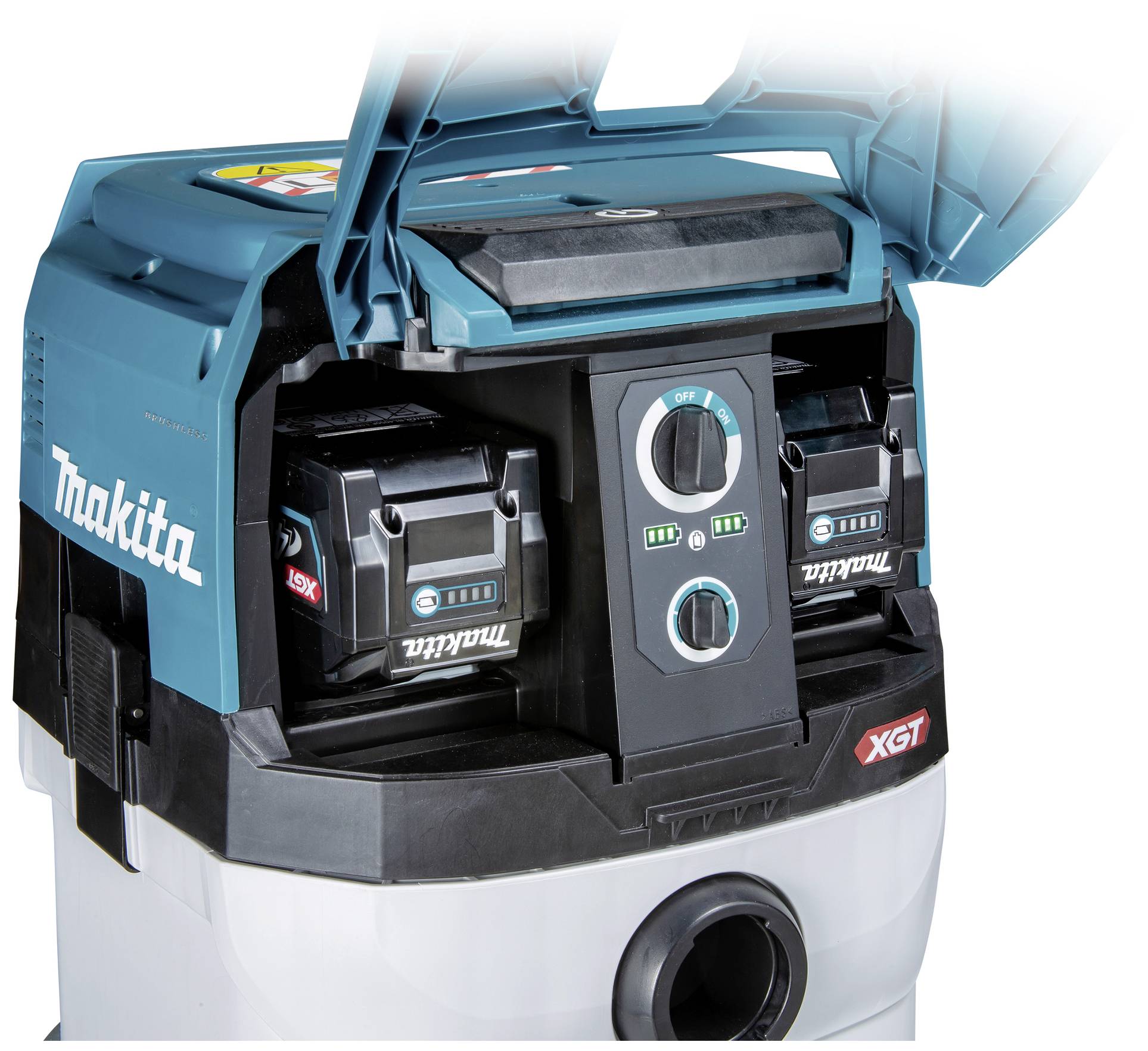 Un aspirateur avec deux batteries insérées. La marque 'Makita' est visible. Le panneau de commande présente un grand bouton avec différents réglages.
