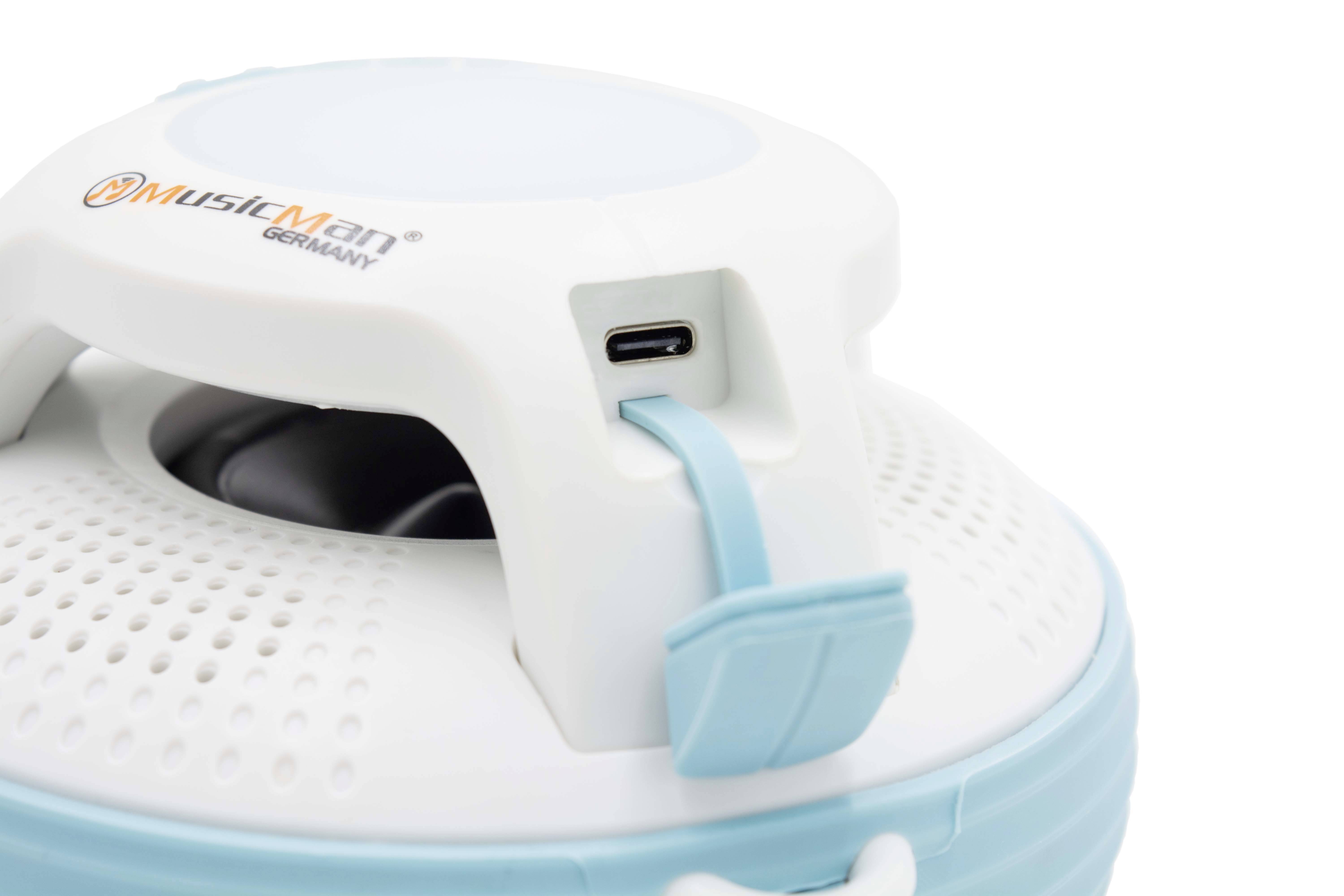 Enceinte portable avec boîtier blanc et touches bleues. Elle dispose d'un port USB et d'une sangle de transport pratique.