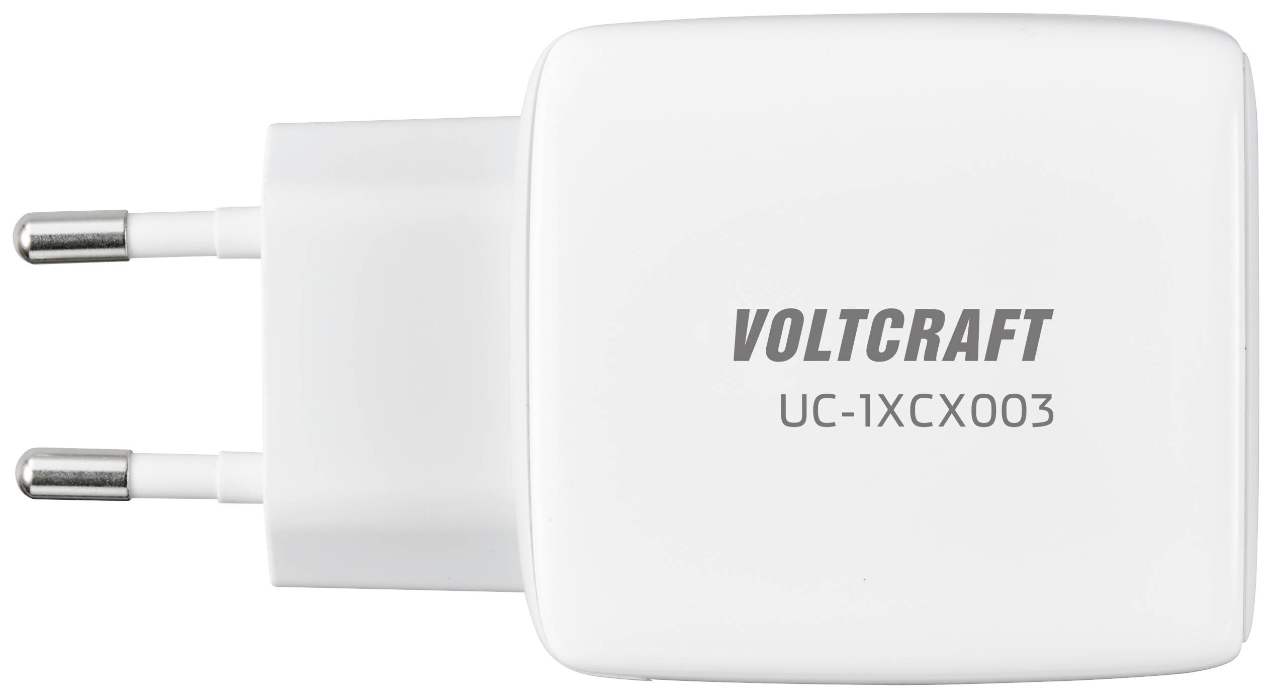 Un chargeur blanc de la marque Voltcraft, modèle UC-1XCX003, avec deux fiches pour la prise électrique européenne.