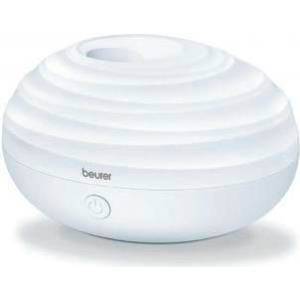 Un humidificateur d'air rond, blanc, à surface rainurée et avec une sortie centrale. Le nom de marque 'beurer' est inscrit sur la face avant.
