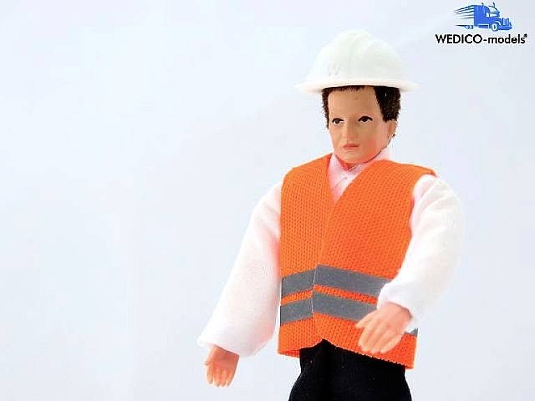 Figurine de jouet portant un casque blanc et un gilet orange, debout contre un fond clair. Nom de marque 'WEDICO-models' en haut à droite.