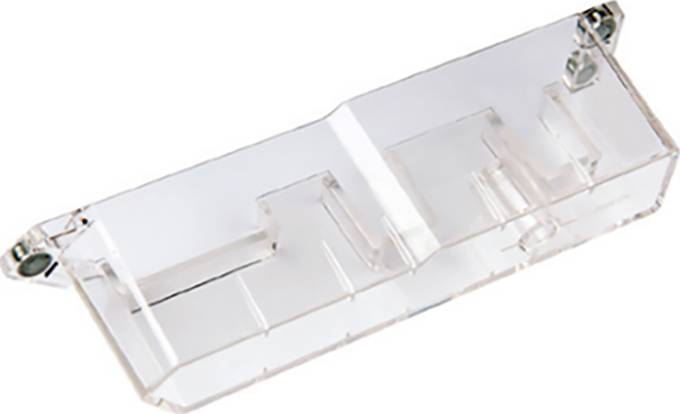 Récipient en plastique transparent à plusieurs compartiments et raccordements, probablement un élément d'un dispositif technique ou d'une machine.