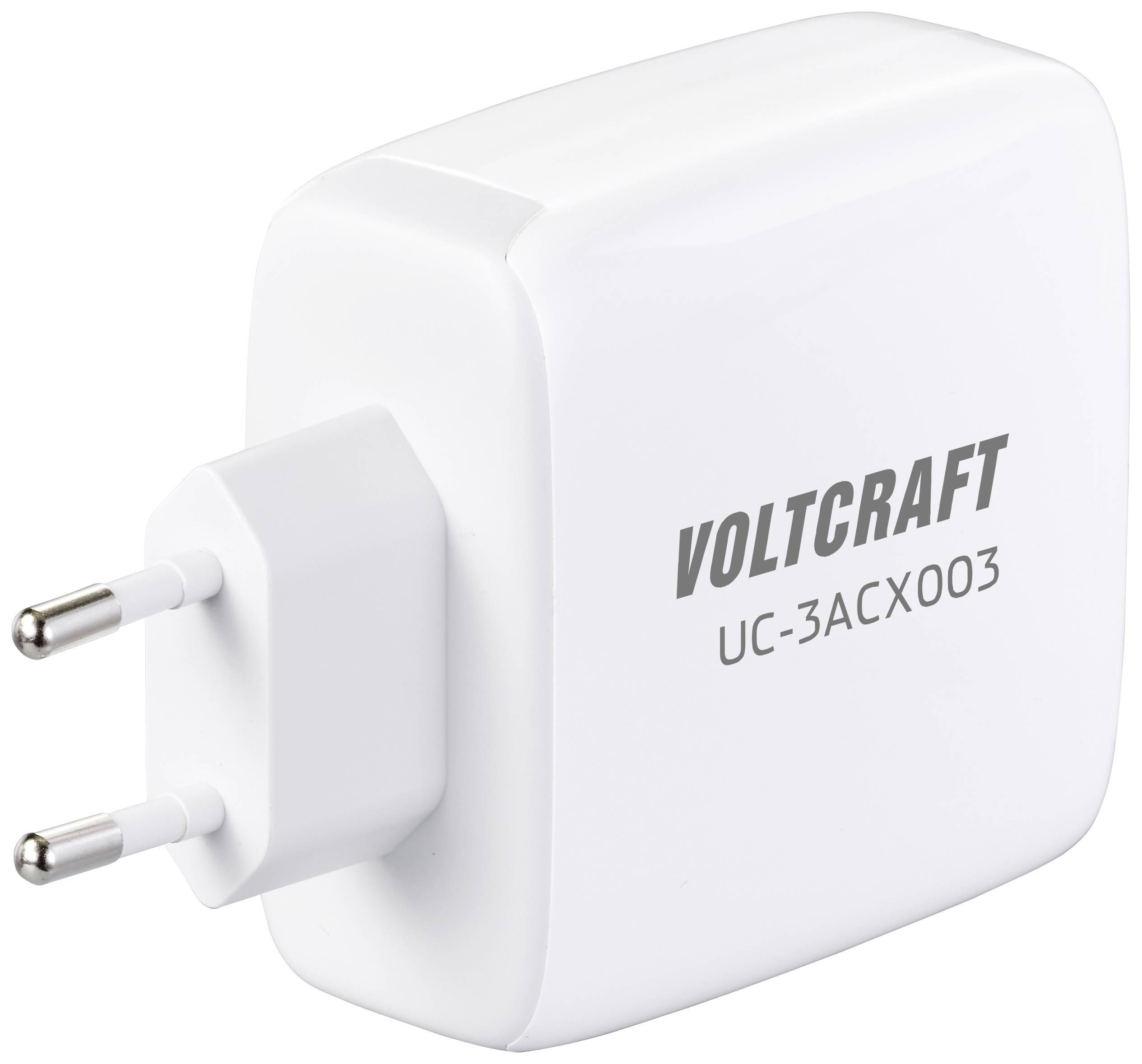 Un bloc d'alimentation blanc de la marque Voltcraft, modèle UC-3ACX003, avec deux broches métalliques pour se brancher à une prise de courant.