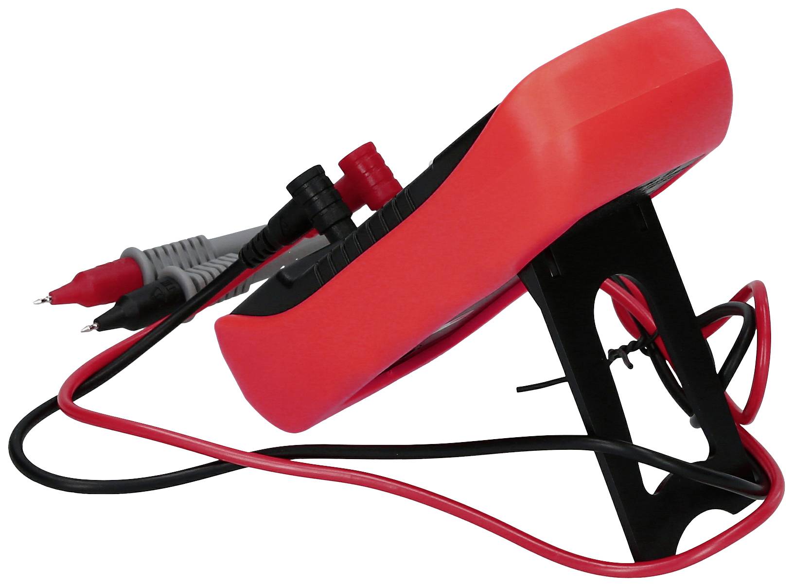 Multimètre numérique rouge avec des câbles de mesure, placé sur un support. Utilisé pour mesurer des valeurs électriques telles que la tension et le courant.