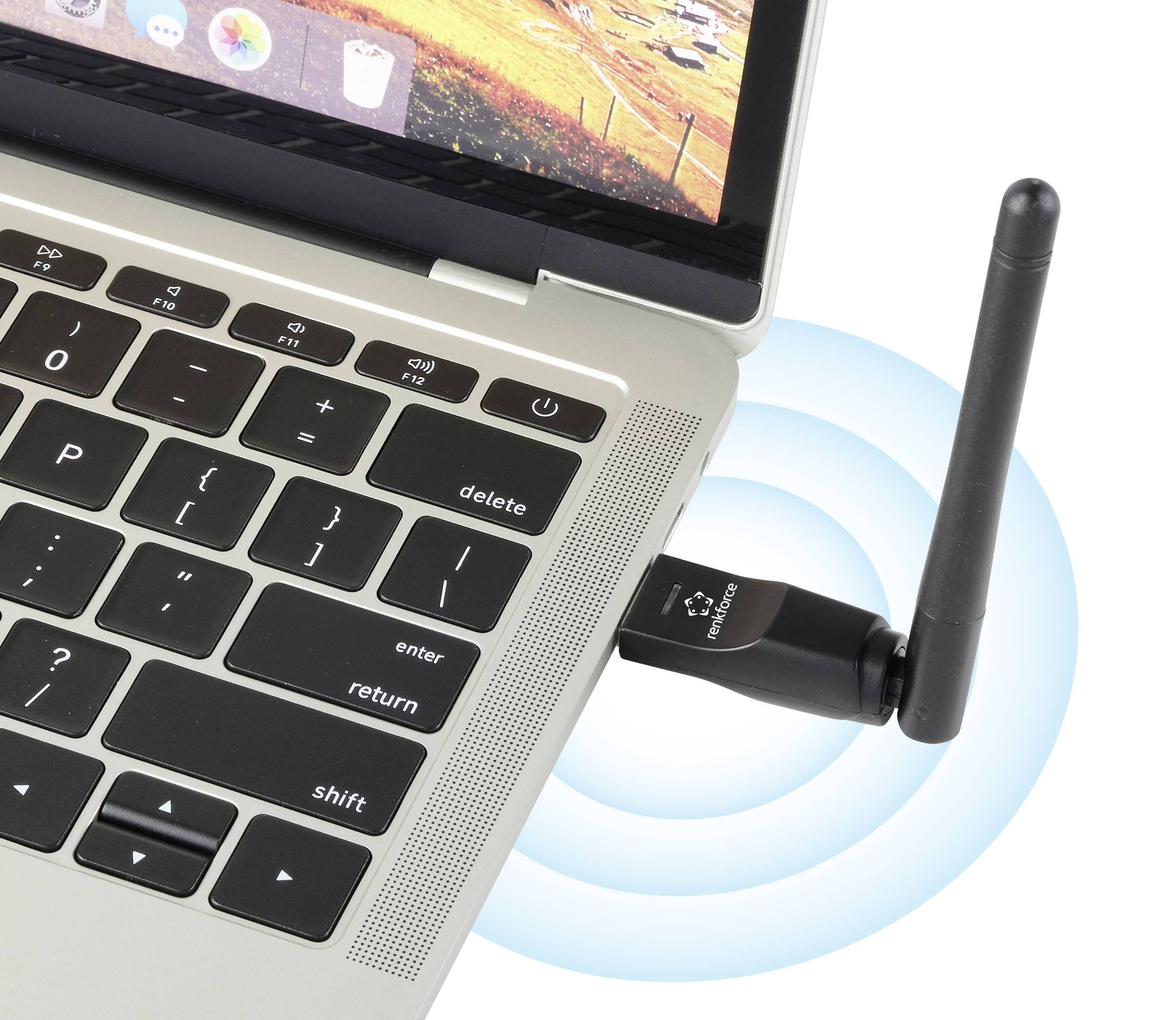 Un ordinateur portable équipé d'un adaptateur Wi-Fi. L'appareil émet un signal radio, visible par des lignes ondulées bleues.