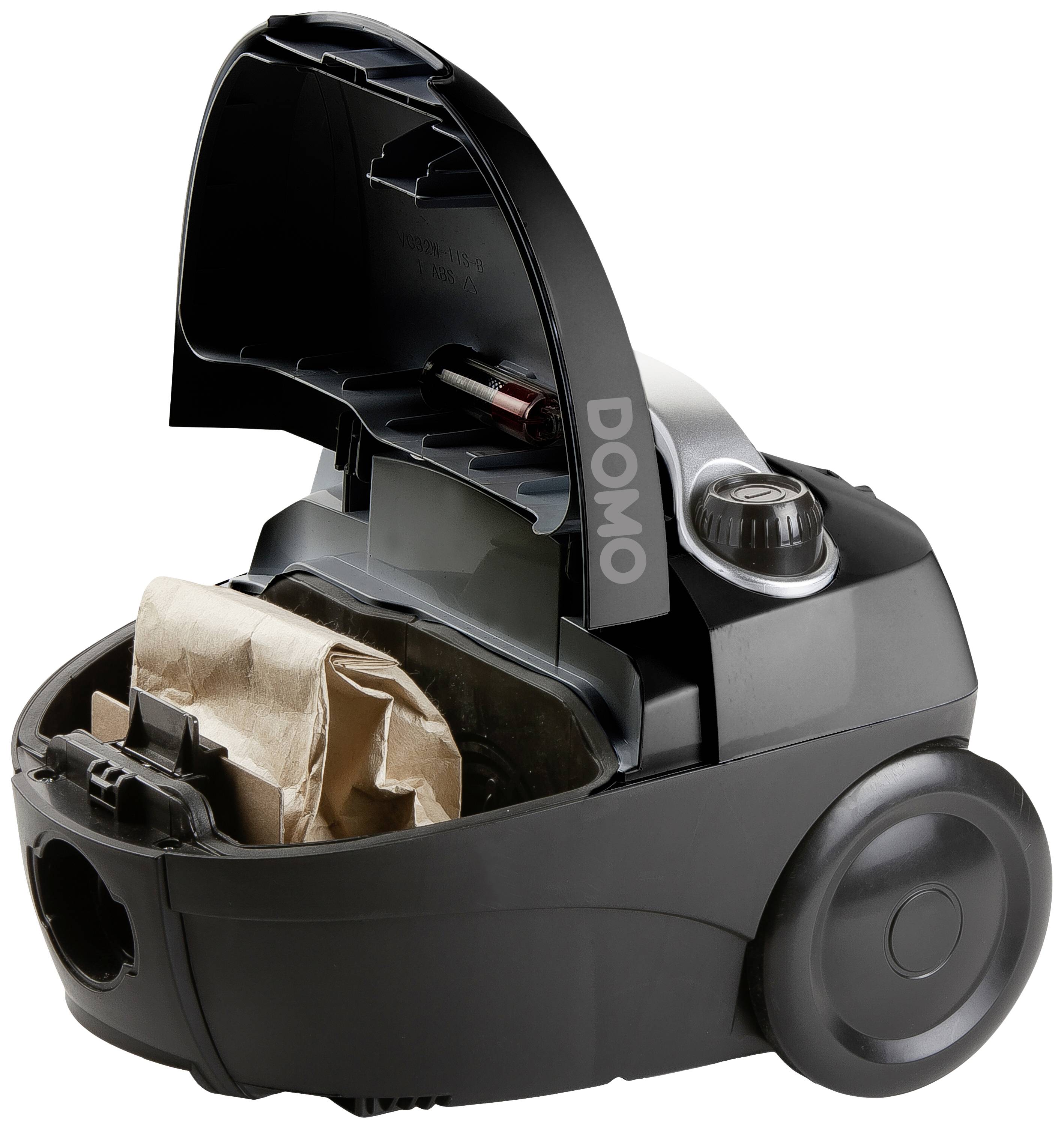 Aspirateur ouvert avec un sac à poussière installé, dont le couvercle porte l'inscription 