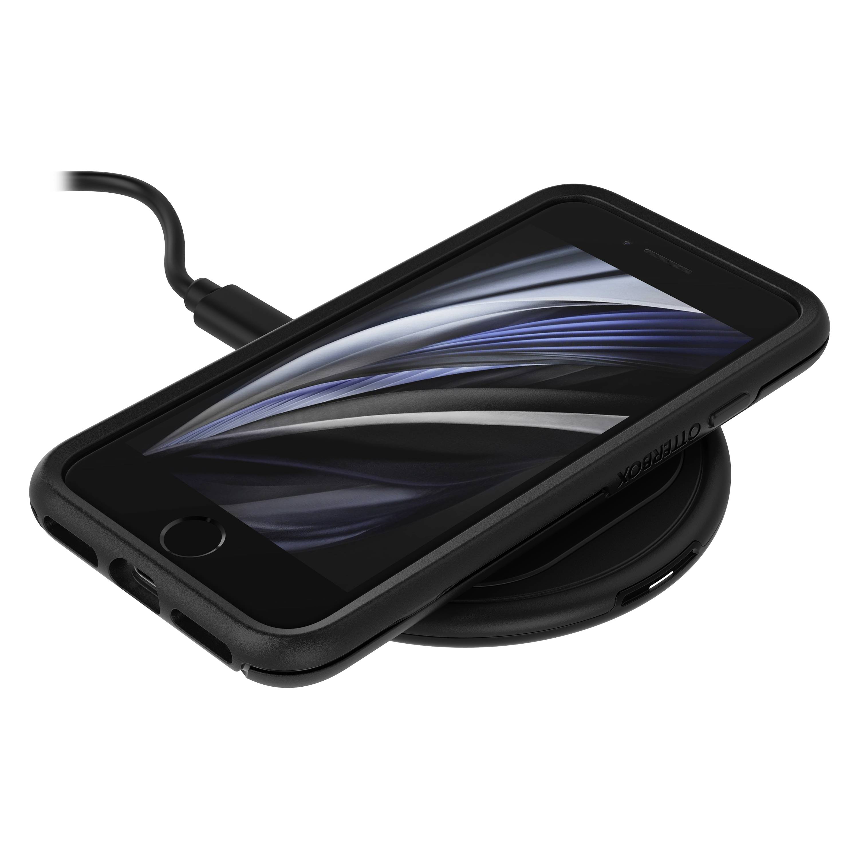 Un smartphone est posé à plat, écran vers le haut, sur un chargeur sans fil raccordé à une source d'alimentation par un câble.