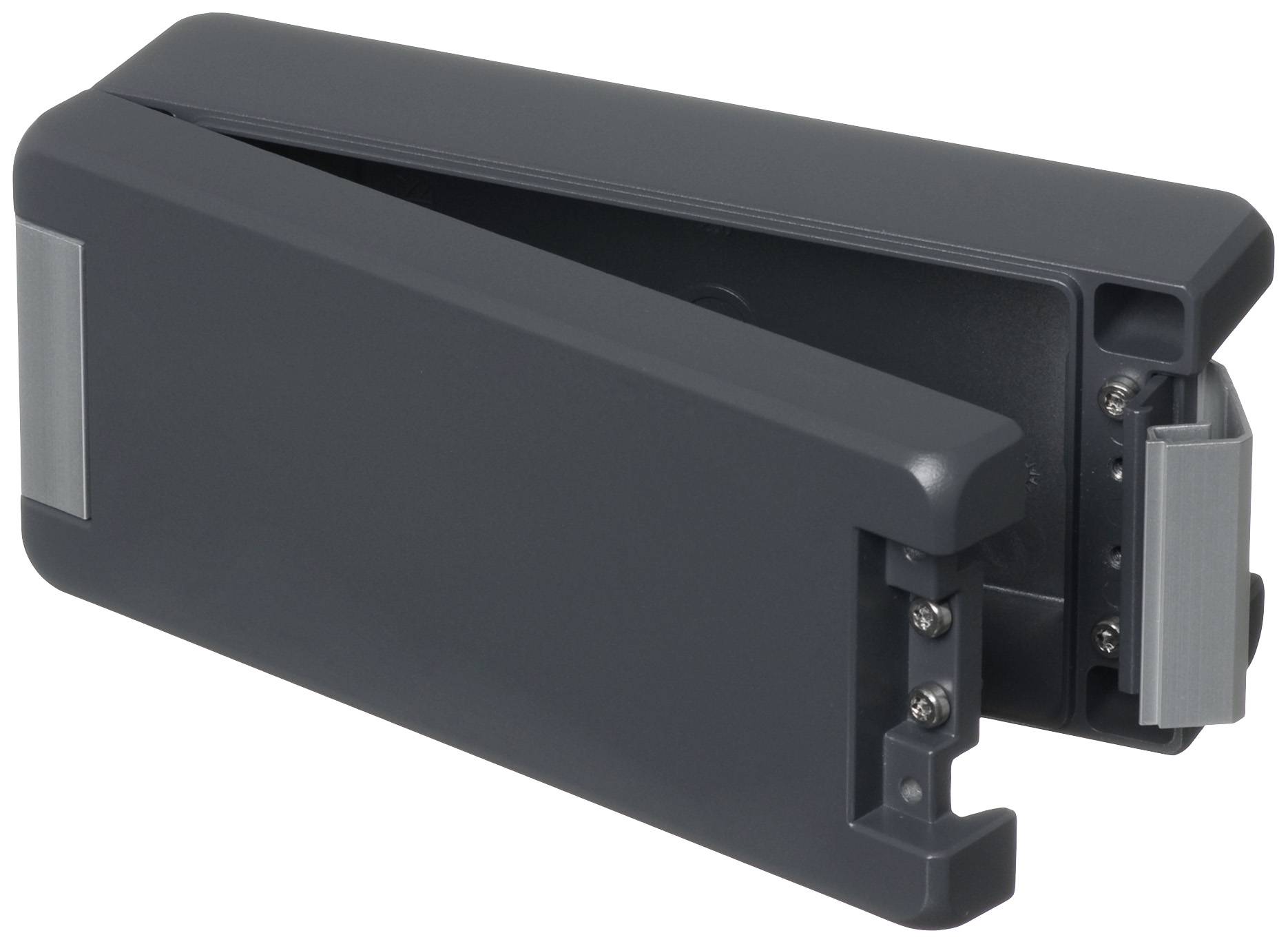 Un boîtier rectangulaire noir en plastique avec des charnières et des contacts métalliques à l'intérieur, probablement un composant technique.