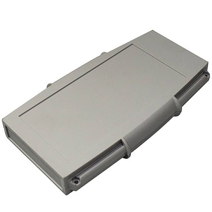 Un boîtier en plastique gris, rectangulaire avec des bords arrondis.