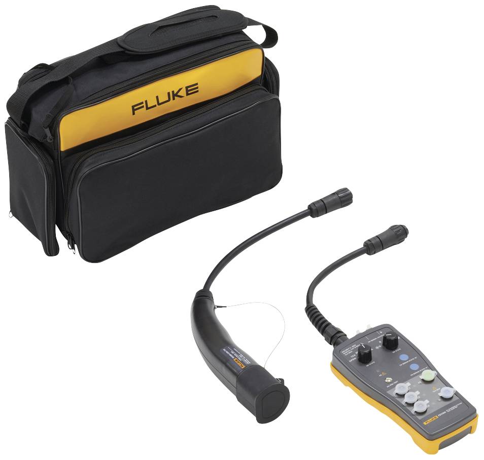 Un appareil de mesure jaune avec un boîtier noir et des câbles est posé devant un sac noir portant l'inscription 'FLUKE'. L'appareil est adapté à la recherche de fuites.