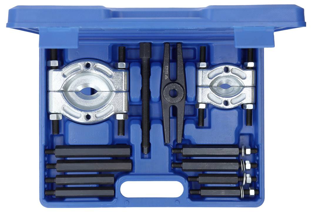 Une boîte à outils bleue contenant un jeu d'extracteur de roulement avec divers composants et outils d'extraction soigneusement rangés dans le coffret.