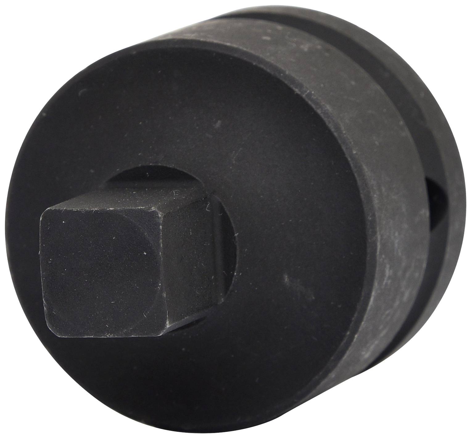 Un écrou noir, cylindrique, à entraînement carré. Utilisé pour desserrer ou fixer des vis ou des écrous.