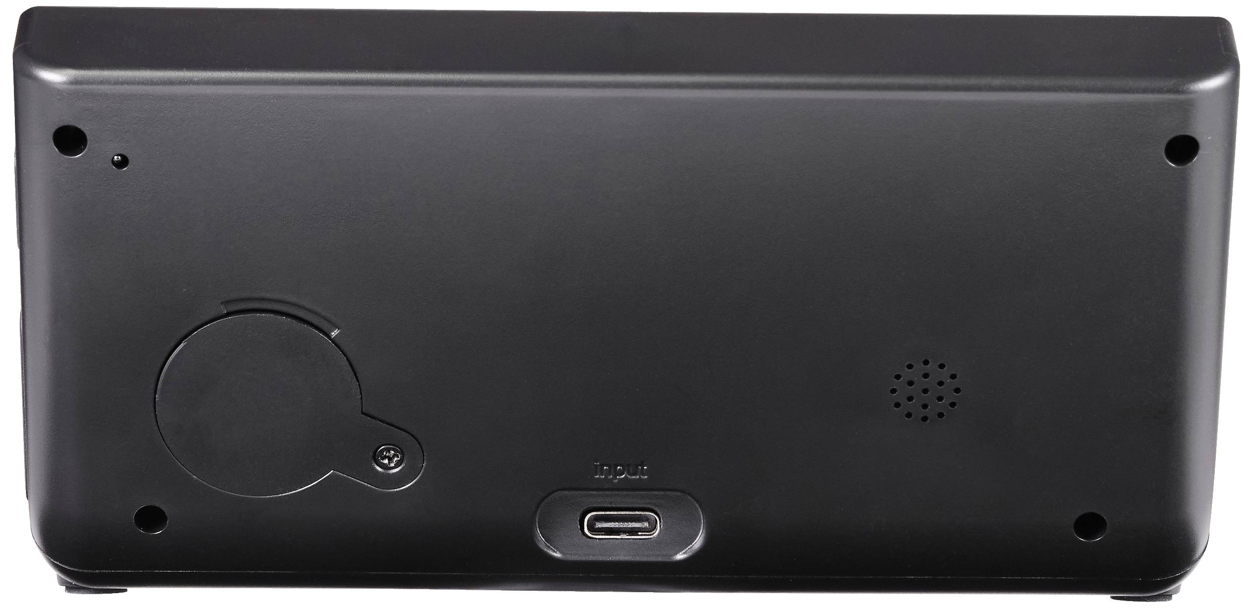 Dos d'un appareil électronique noir avec entrée USB-C, grille de haut-parleur et couvercle de compartiment de batterie. Aucun logo visible.