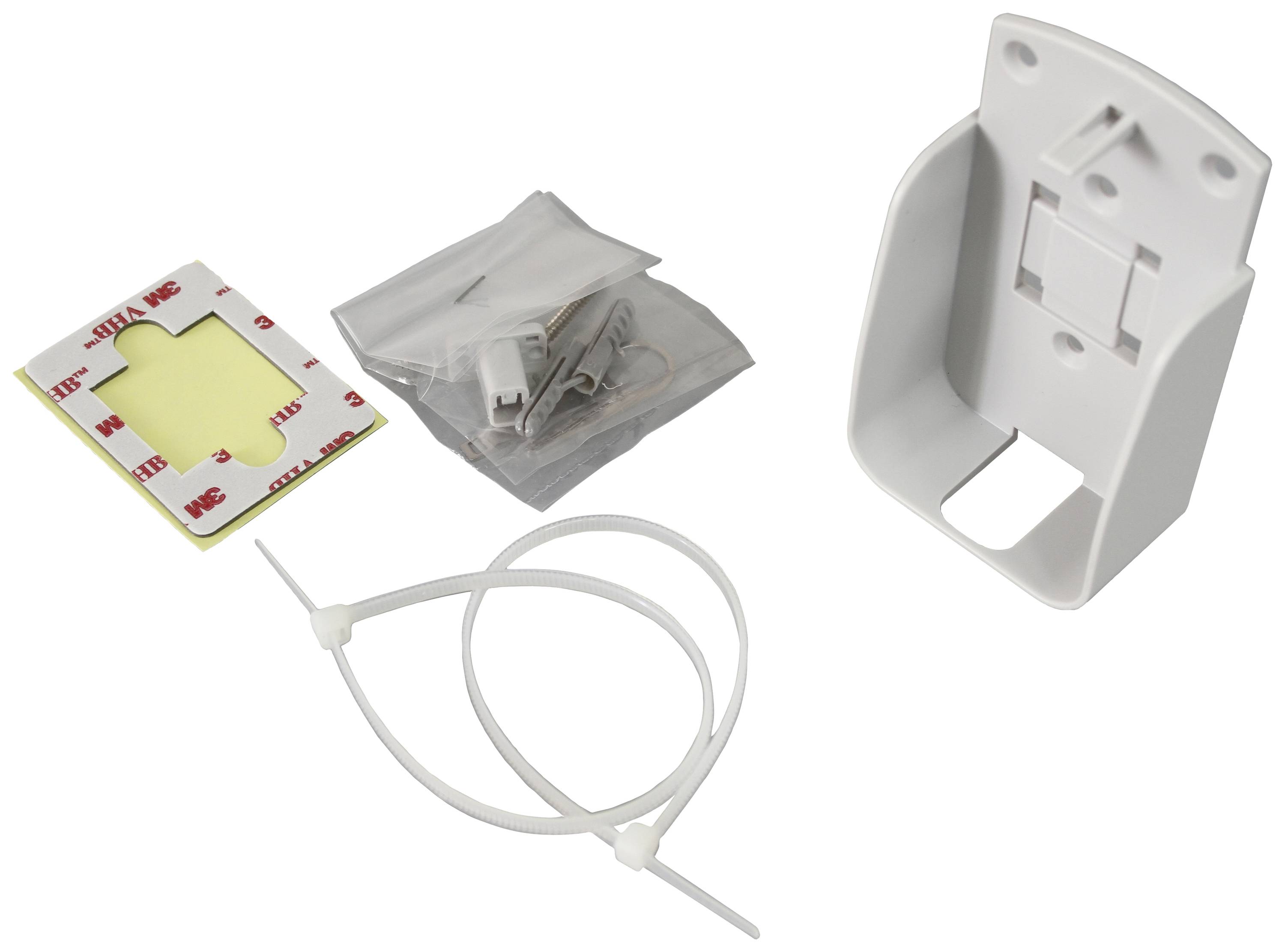 Kit de montage avec supports en plastique, double face, colliers de serrage et vis. Idéal pour fixer de petits appareils aux murs.