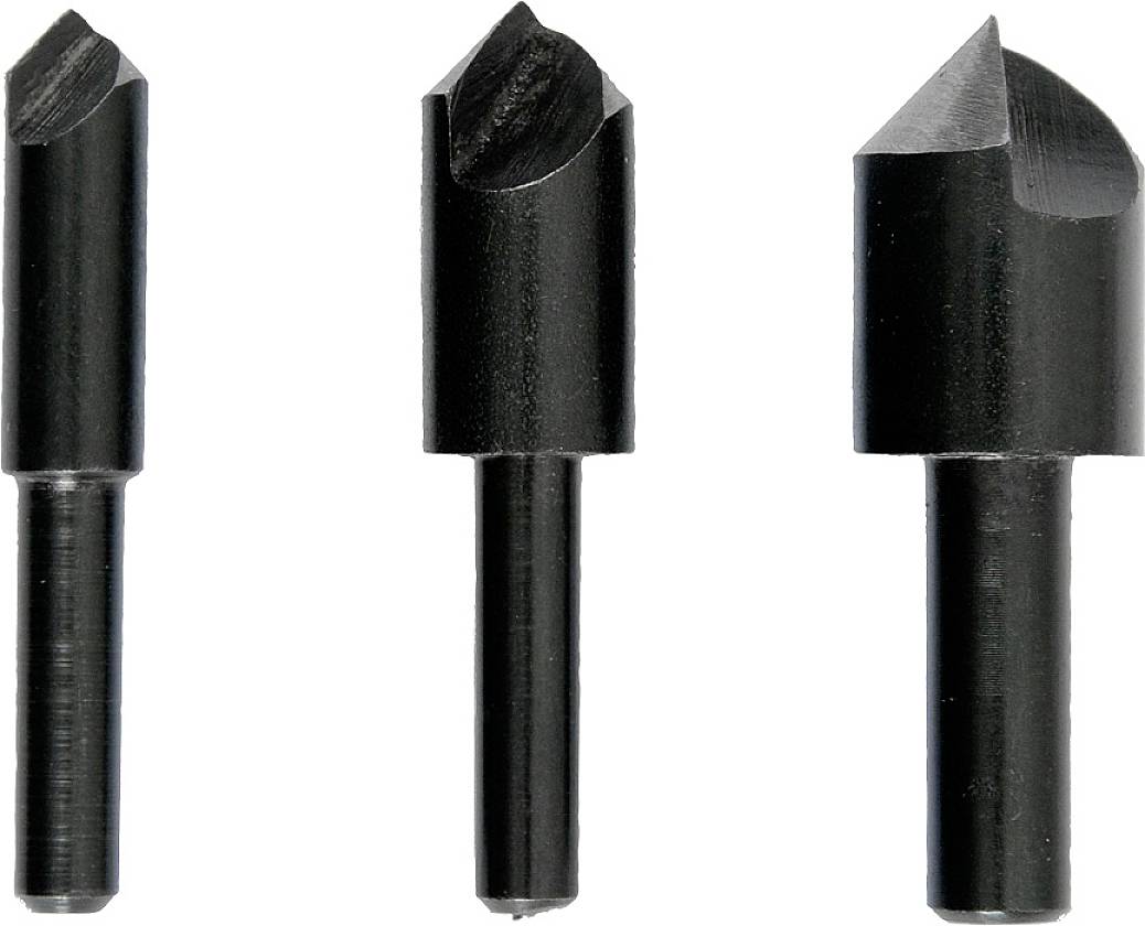 Trois forets noirs avec des têtes plates et pointues, debout verticalement. Adaptés pour l'usinage du bois ou du métal.