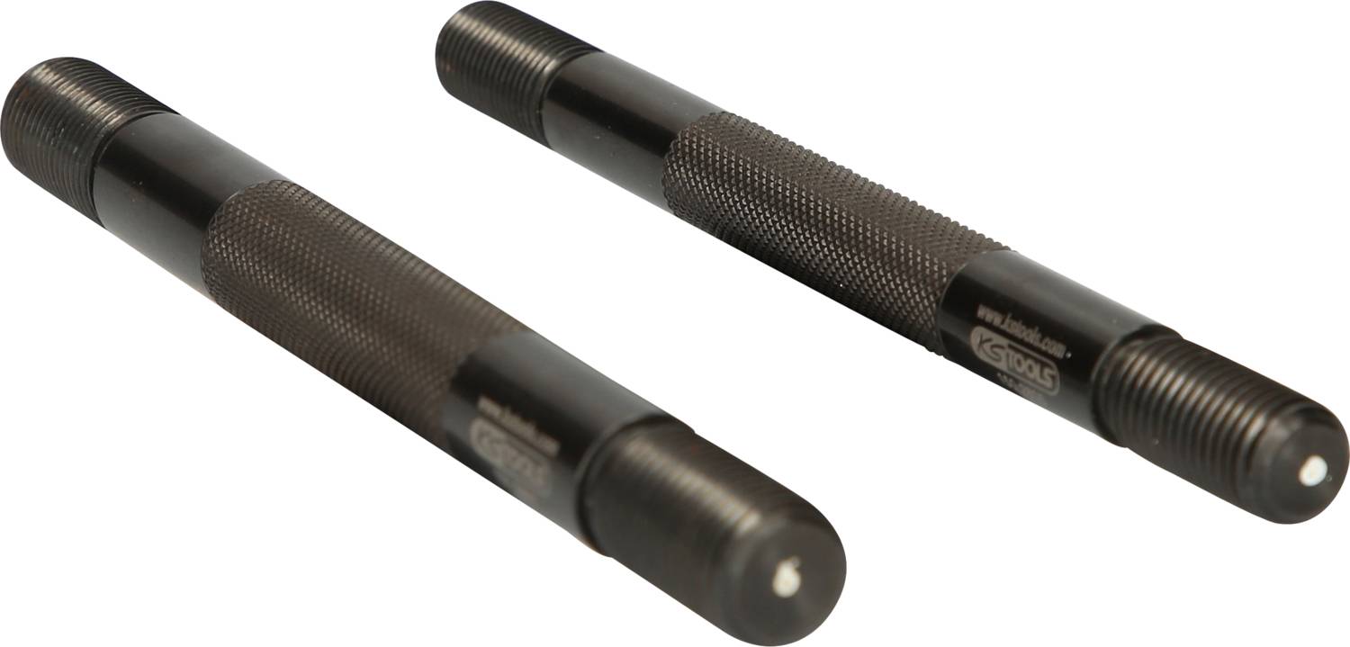 Deux outils cylindriques noirs avec filetage et poignée striée pour une meilleure prise, posés sur un fond blanc.