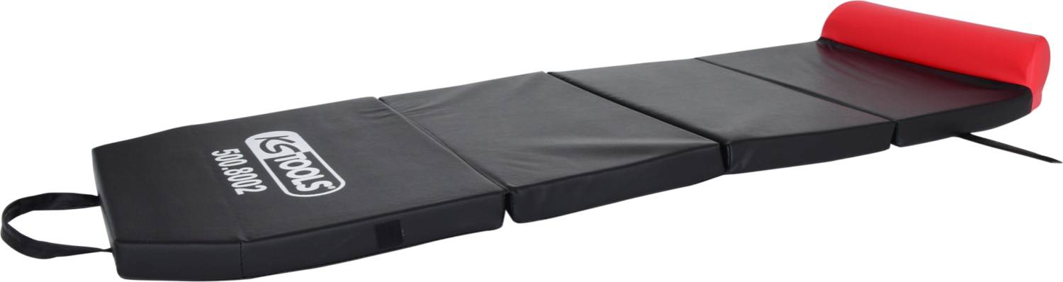 Tapis d'atelier noir pliable avec appui-tête rouge et poignée de transport, idéal pour travailler confortablement au sol.
