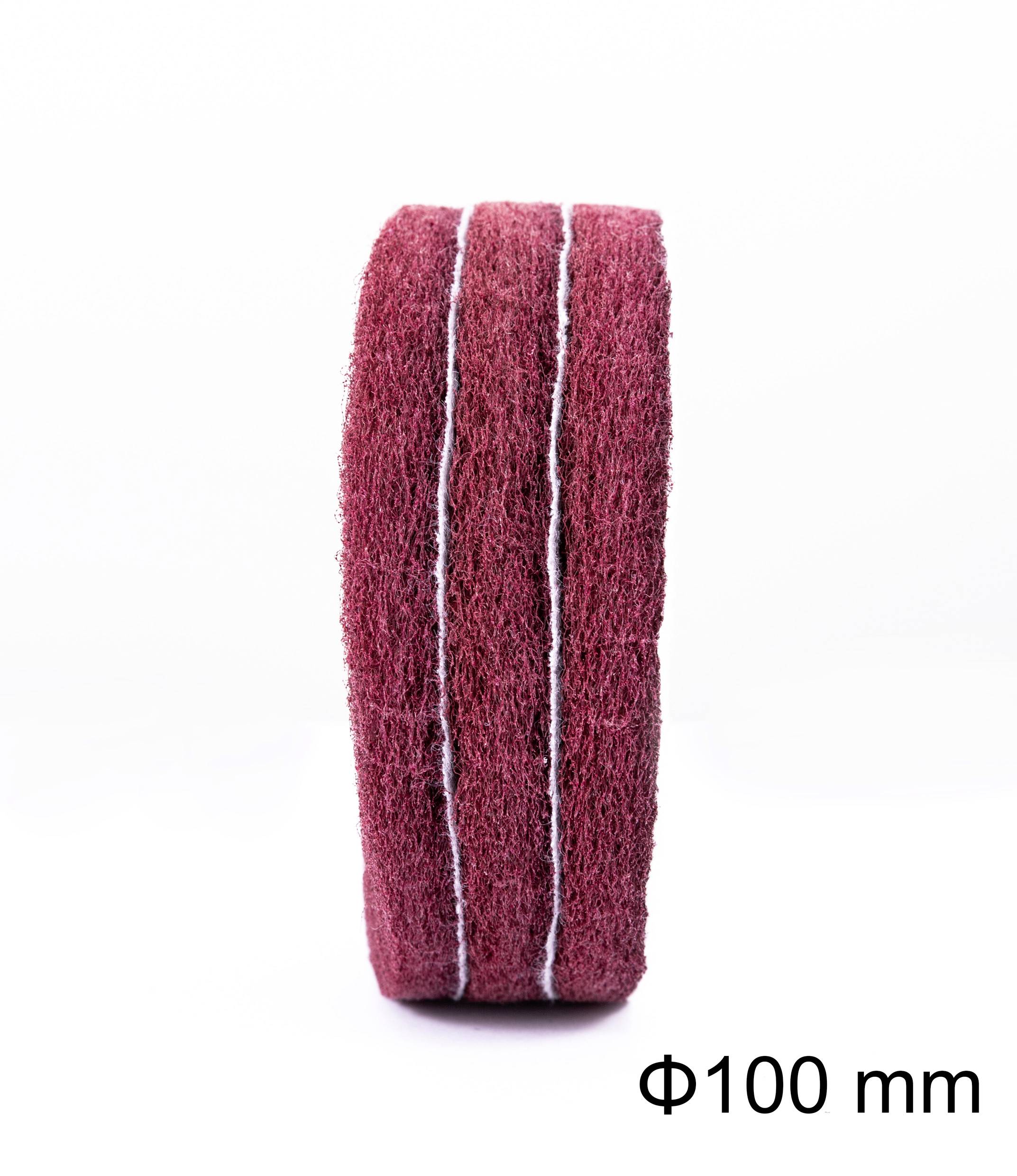 Disque abrasif rouge de 100 mm de diamètre.