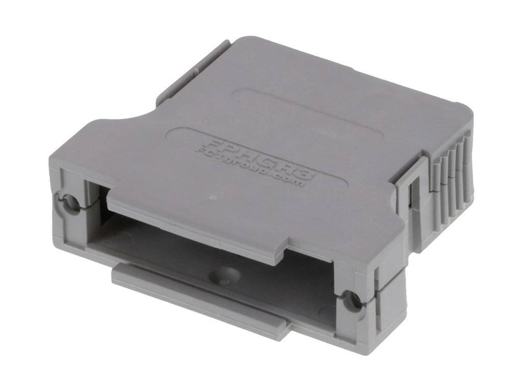 Une pièce en plastique grise de forme rectangulaire avec une ouverture centrale, probablement un élément de fixation.