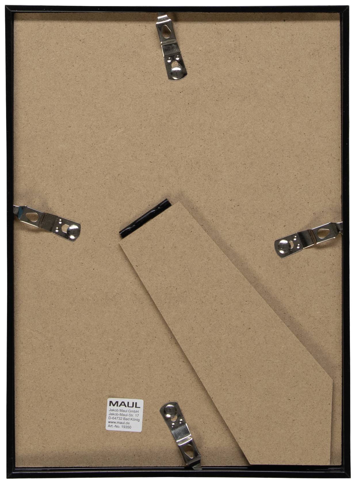 Un cadre photo est dressé verticalement sur un support en bois, maintenu par des agrafes métalliques. Un support de maintien est visible.