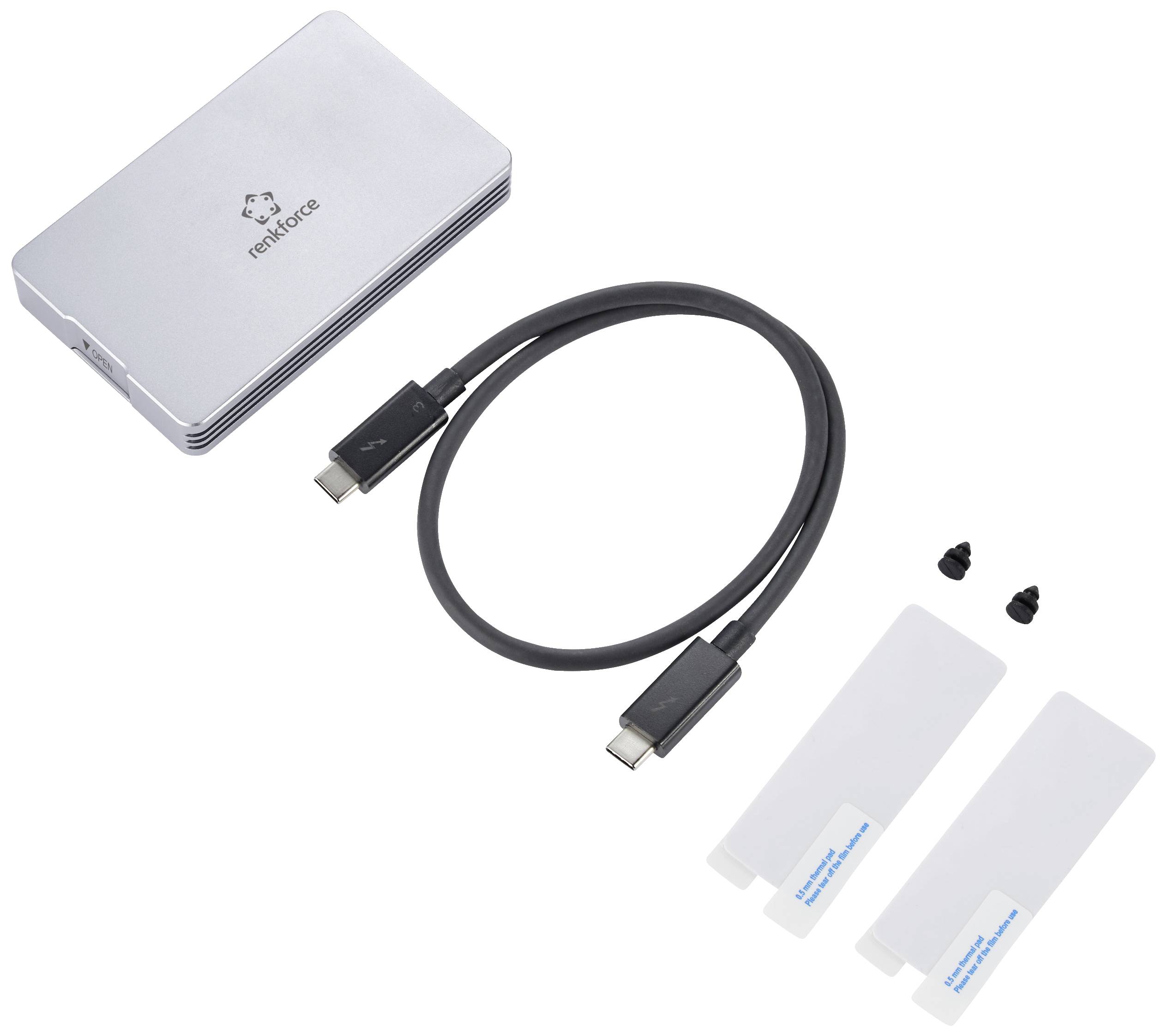 Un boîtier argenté pour un SSD externe, un câble USB-C noir, deux vis et deux tampons thermiques sur un fond blanc.