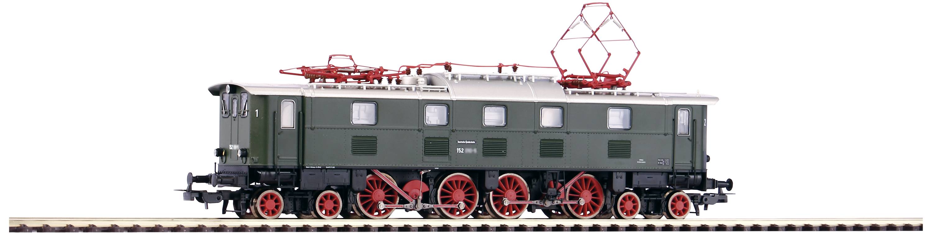 Un modèle de locomotive historique peinte en vert avec des roues rouges sur des rails. Deux pantographes sont visibles en haut.