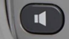 Une touche de volume avec un symbole de haut-parleur dessus, probablement provenant d'un appareil électronique.