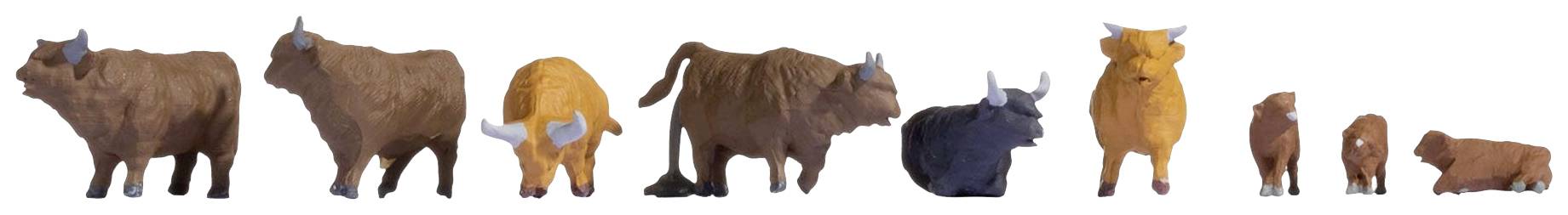 Différentes figurines en plastique de bovins, taureaux et vaches de tailles et de couleurs variées sont disposées côte à côte.