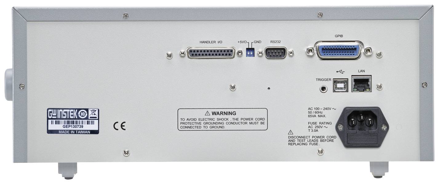 Vue arrière d'un appareil électronique avec plusieurs ports et un avertissement. Zone supérieure : ports série, parallèle et LAN. Zone inférieure : connexion d'alimentation et interrupteur.
