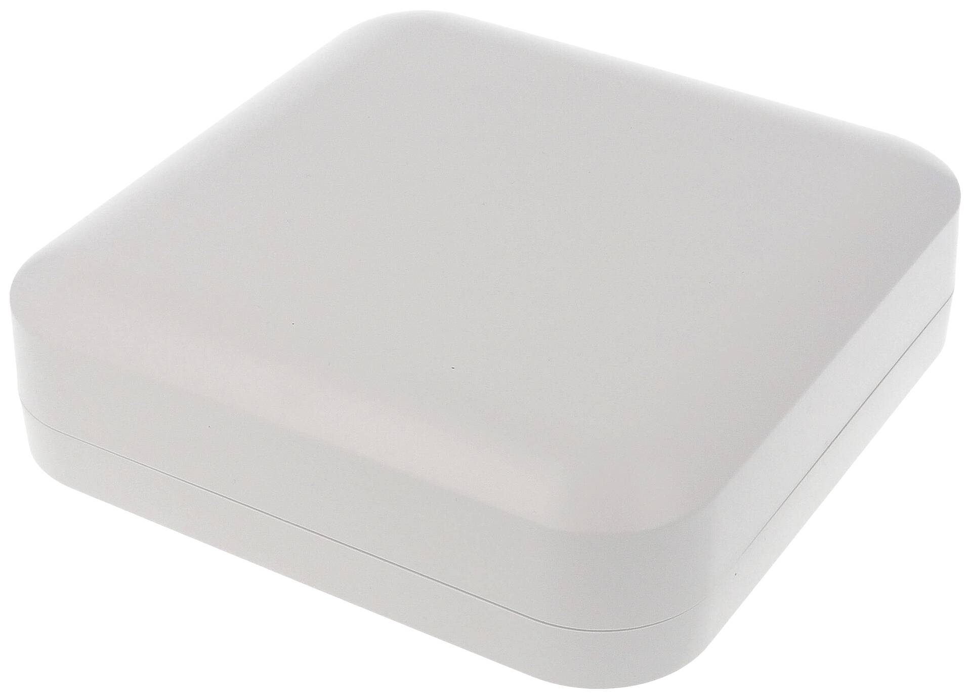 Boîte blanche, carrée, aux coins arrondis, fermée et conçue de manière minimaliste.