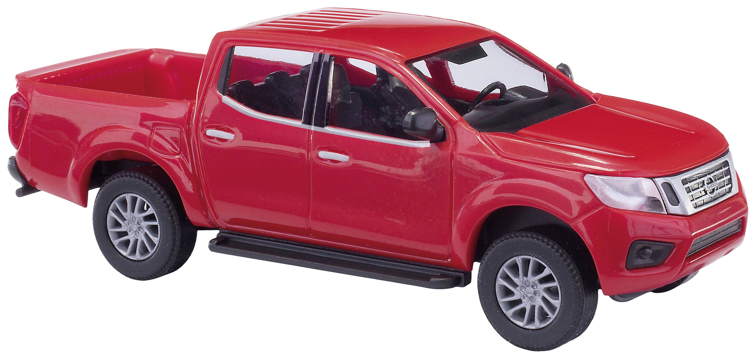 Camion de jouet rouge sur fond blanc, avec un focus sur les détails du véhicule tels que la carrosserie, les pneus et la benne ouverte.