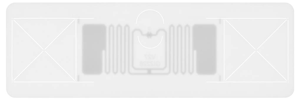 Une télécommande rectangulaire grise avec un interrupteur central et un motif symétrique. La fonction semble être de nature technique.