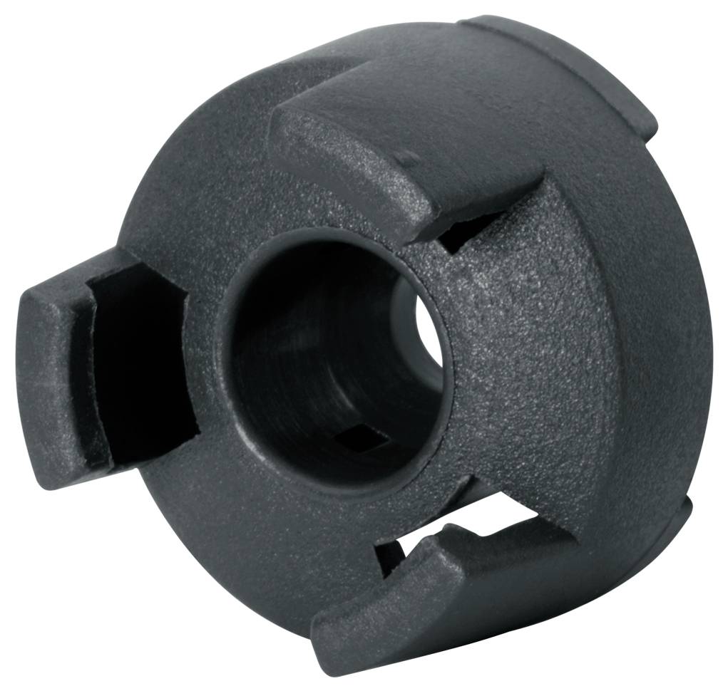 Composant mécanique noir de forme précise avec plusieurs fentes, probablement partie d'un système d'embrayage ou de connexion.