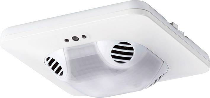 Un détecteur de présence plafond blanc avec des capteurs pour le contrôle de l'éclairage et des mouvements.