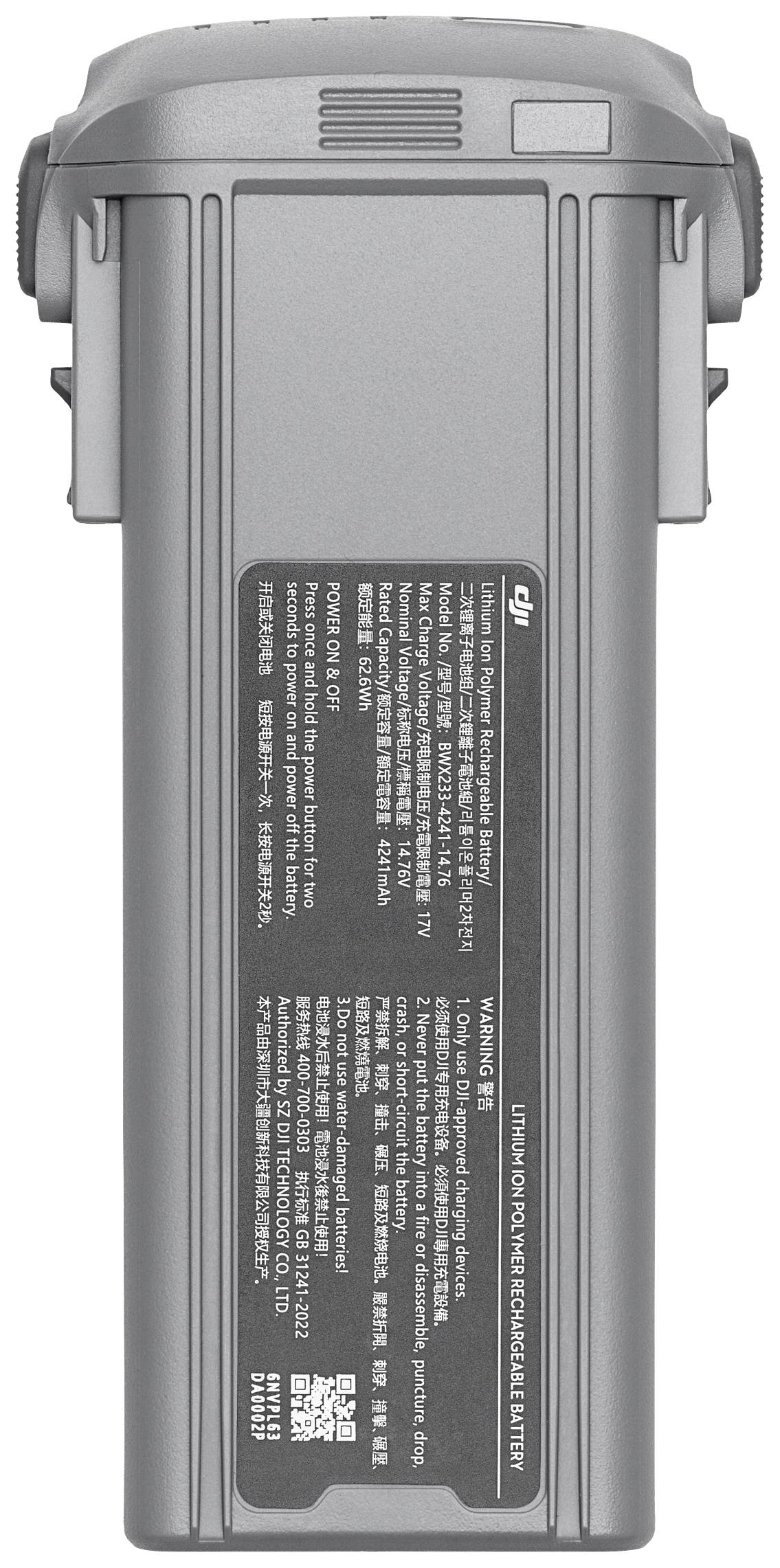 Batterie rechargeable couleur argent avec inscription. Le texte principal sur la batterie indique les spécifications techniques et les avertissements.
