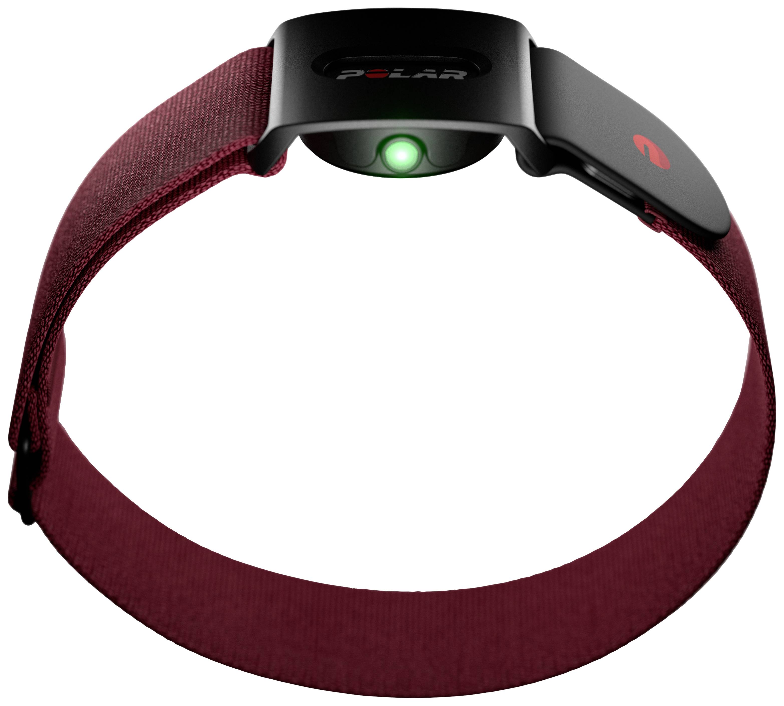 Un bracelet rouge avec un capteur noir au centre. Le capteur a une lumière verte et pourrait être utilisé pour mesurer la fréquence cardiaque.