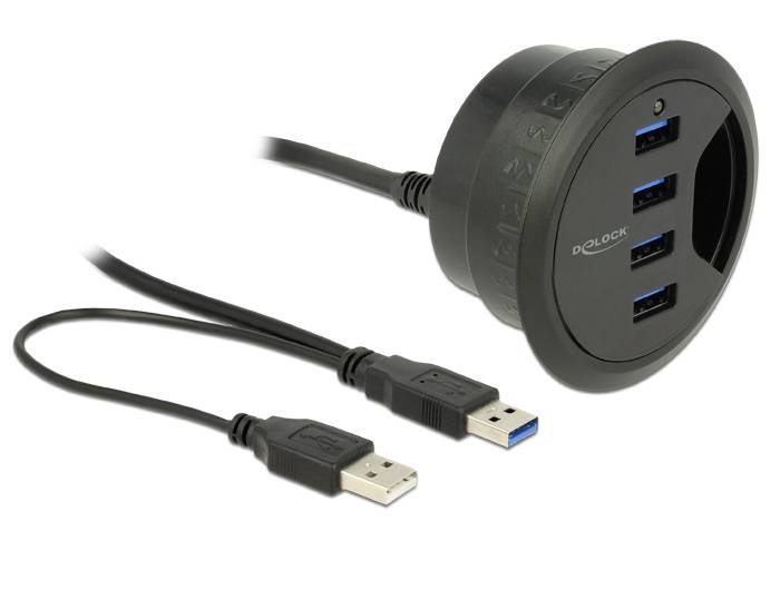 Concentrateur USB noir et rond avec trois ports USB 3.0, intégré dans une table. Deux câbles USB sont posés à côté.