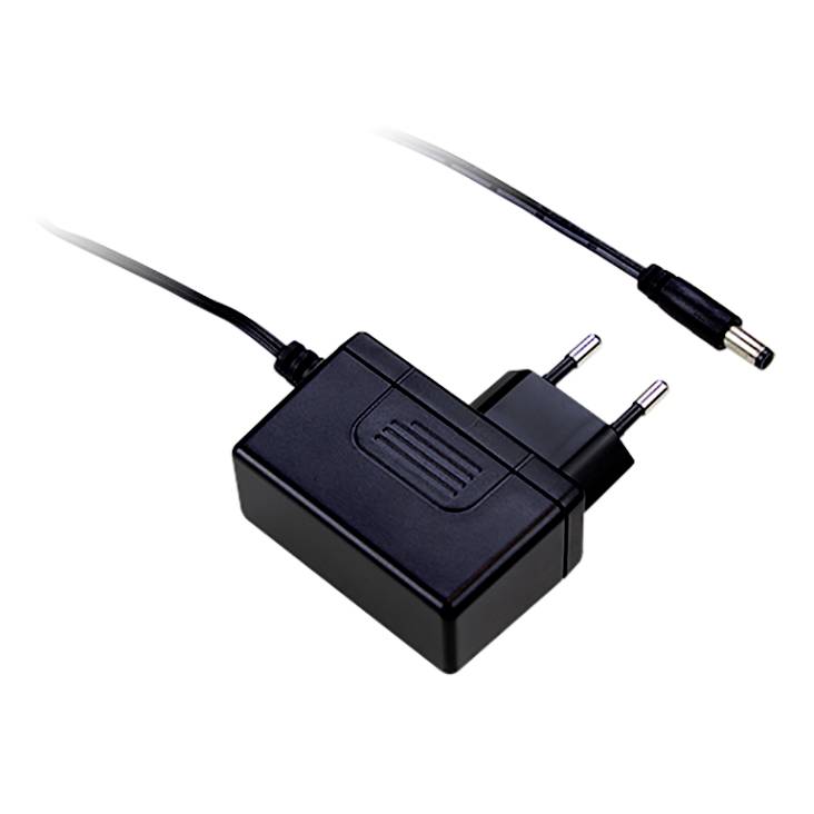 Adaptateur secteur noir avec fiche européenne et connexion de câble séparée, adapté pour charger des appareils électroniques.