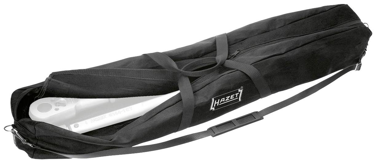 Sac noir avec poignées et bandoulière, partiellement ouvert, montrant partiellement un objet blanc à l'intérieur. Marquage 'HAZET'.
