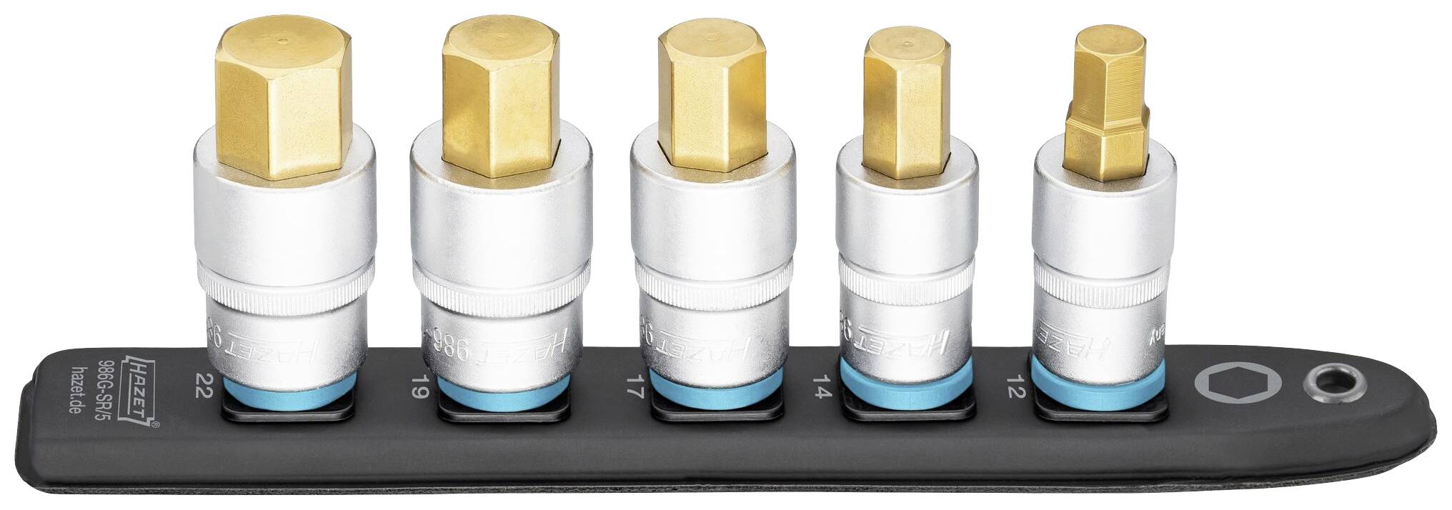 Cinq embouts hexagonaux dorés de différentes tailles, rangés dans un support du plus grand au plus petit.
